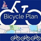 The background is dark blue. A clip of a map centered on Libertyville is in the center with white outlines of bikes throughout.