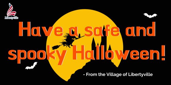 The background is black. In the center is a golden moon with the shadows of a witch flying in the air on a broom above a castle. Text reads "Have a safe and spooky Halloween! From the Village of Libertyville."