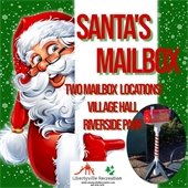 Santa is in front of a green background with snowflakes. He is pointing around a white divider at a photo of a decorated mailbox. Text reads "Santa's Mailbox - Two mailbox locations! Village Hall and Riverside Park."
