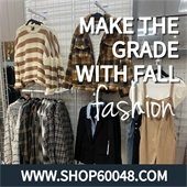 A photo of sweaters and jackets on a store rack. White text says "Make the grade in fall fashion." A navy blue bar stretches across the bottom with white text that says "www.Shop60048.com."