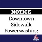 A dark blue background has "NOTICE" in white letters within a black band. In a white rectangle, it reads "Downtown Sidewalk Powerwashing."