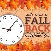 The background is peach. Leaves in all shades of orange line the top and bottom. In the center is a clock with text next to it that says "Don't forget to fall back this weekend - Daylight Saving Time ends November 6th."