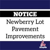 The background is dark blue. In the middle is a white rectangle with a black bar that reads "Notice." Text in the rectangle says "Newberry Lot Pavement Improvements." A logo representing the American flag in the shape of an L is in the bottom right corner and says "Libertyville" underneath.