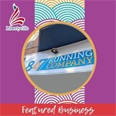 A circle photograph shows a storefront sign that reads "847 Running Company." The photo is on top of a multicolored wave pattern on a deep magenta background with a caption reading "Featured Business."