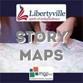 The background is navy blue. In the center is a photo of two hands pointing at a map. At the top is a Libertyville logo; at the bottom is a logo for MGP Municipal GIS Partners. Grey text reads "Story Maps."
