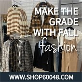 Fall clothes are on display on the wall of a store. Text says "Make the grade with fall fashion."