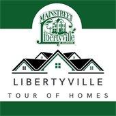 A white box is in the center of a dark green background. At the top is an outline of roofing in black and green. Text reads "Libertyville Tour of Homes."