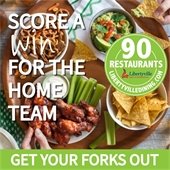 Background is a photo of two hands eating chips and dip off a spread with pretzels and buffalo wings. Text says "Score a Win for the Home Team."
