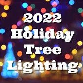 Background is a blurred image of multicolored holiday light and a tree. Text reads "2022 Holiday Tree Lighting."