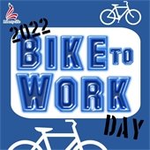 Bold blue letters read "Bike to Work" with stenciled "2022" and "Day" on opposite ends in a white rectangle on a blue background. White bicycle outlines are in opposite corners and a patriotic "L Libertyville" logo sits in the top left-hand corner.